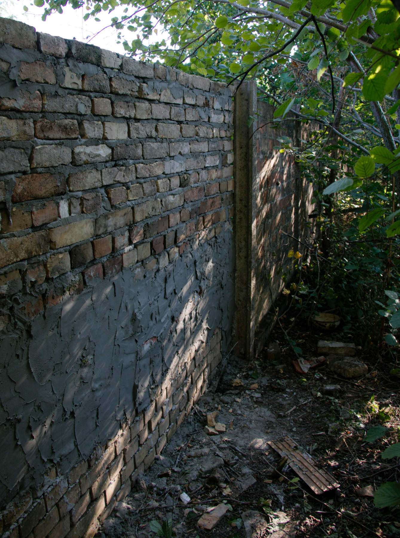 The extra mortar is where the old wall ends.