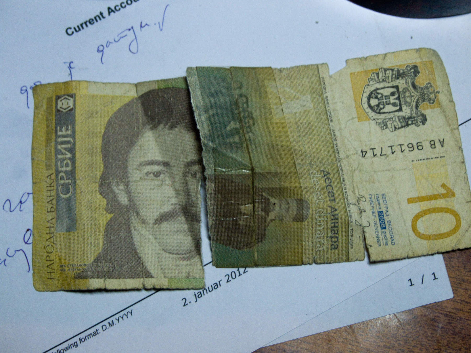 Completely unrelated except by date. Someone tried to patch this. It's worth 0,10$.