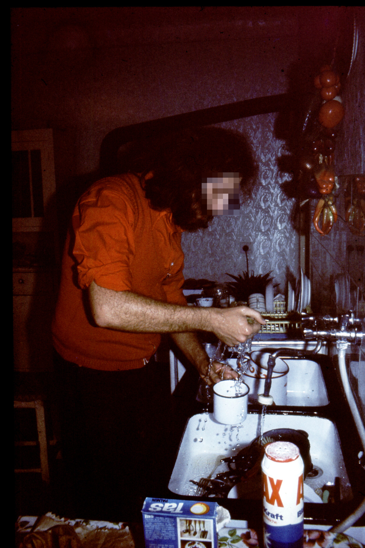 I don't cook, ergo dishes. The pattern on the wall has the metallic sheen, so popular in the sixties until you try to paint it over.